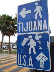 \"Pedestrian_border_crossing_sign_Tijuana_Mexico\"